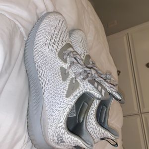 Adidas Alphabounce 1 tennis shoes.